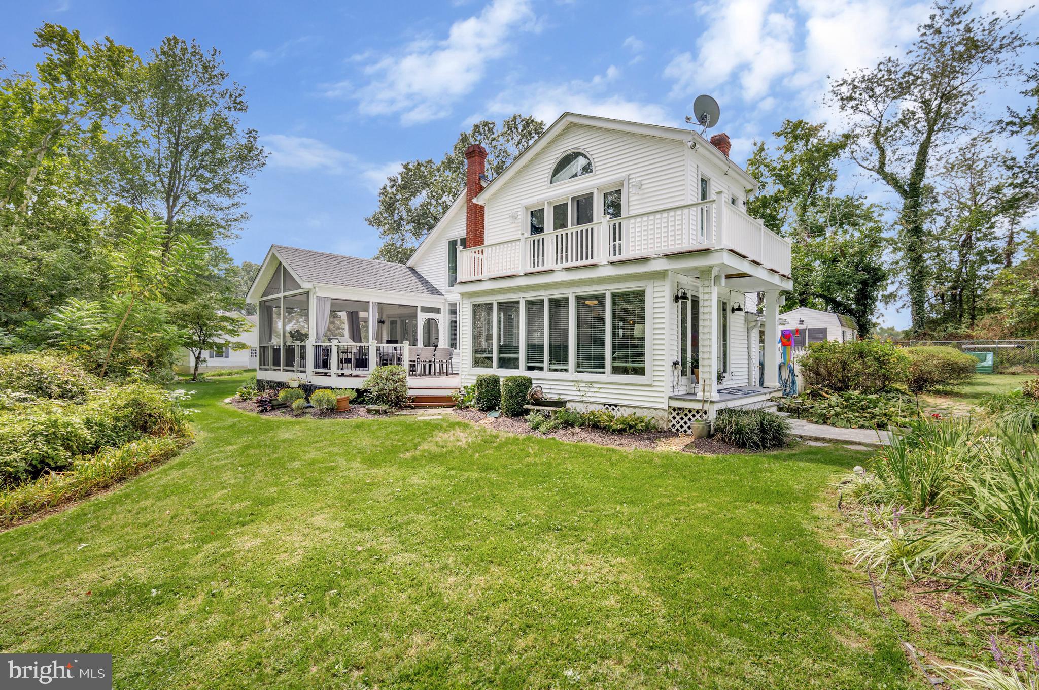 605 Barstow Road Prince Frederick, MD 20678 - Photo 40 of 57 a front view of a house with a yard table and chairs