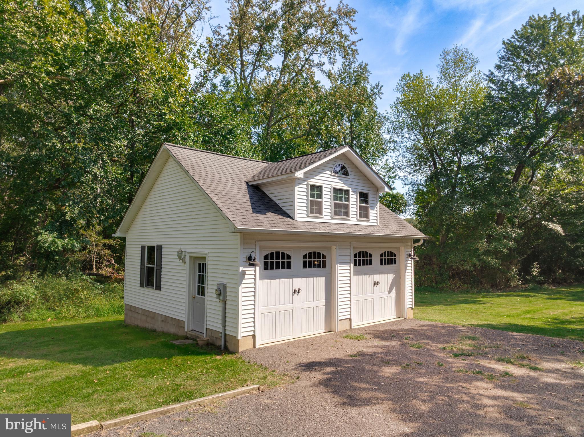 605 Barstow Road Prince Frederick, MD 20678 - Photo 43 of 57 a front view of a house with a garden
