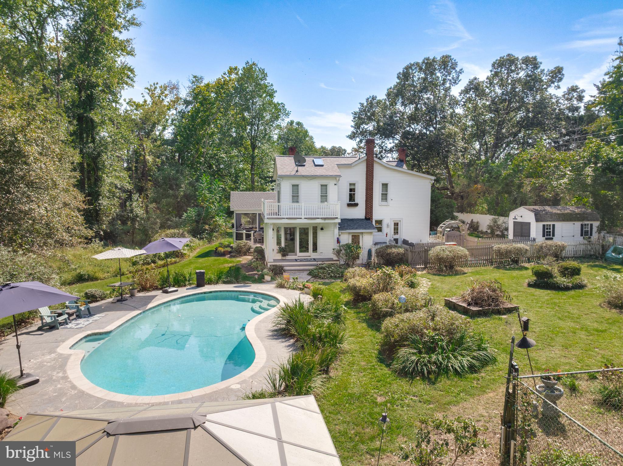 605 Barstow Road Prince Frederick, MD 20678 - Photo 46 of 57 a house view with a swimming pool and outdoor seating