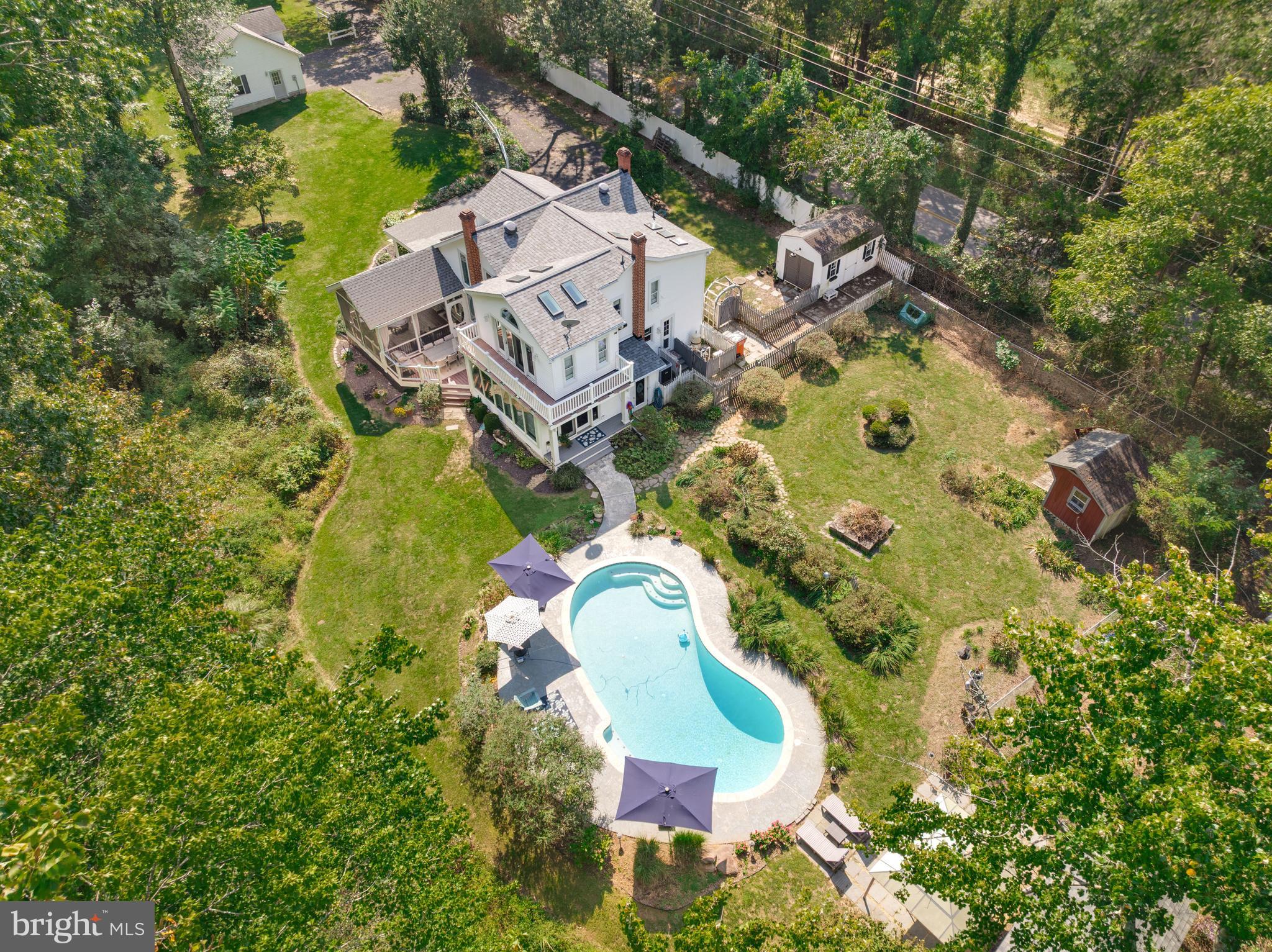 605 Barstow Road Prince Frederick, MD 20678 - Photo 51 of 57 an aerial view of a house with a swimming pool and outdoor space