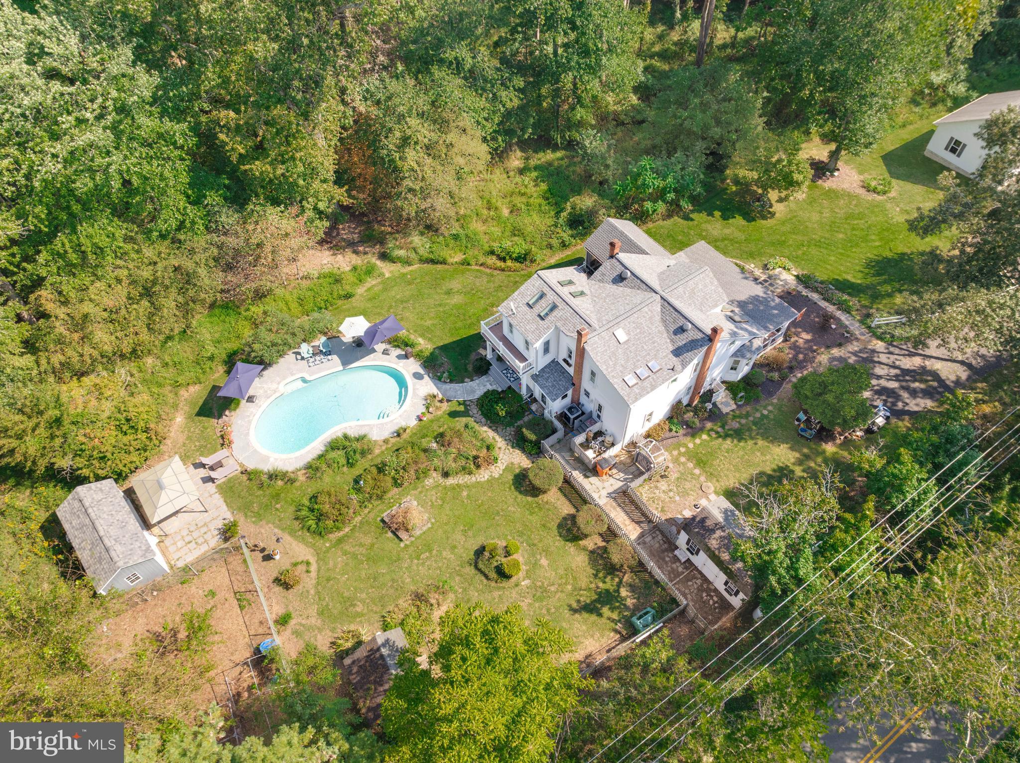 605 Barstow Road Prince Frederick, MD 20678 - Photo 52 of 57 an aerial view of a house with yard and parking