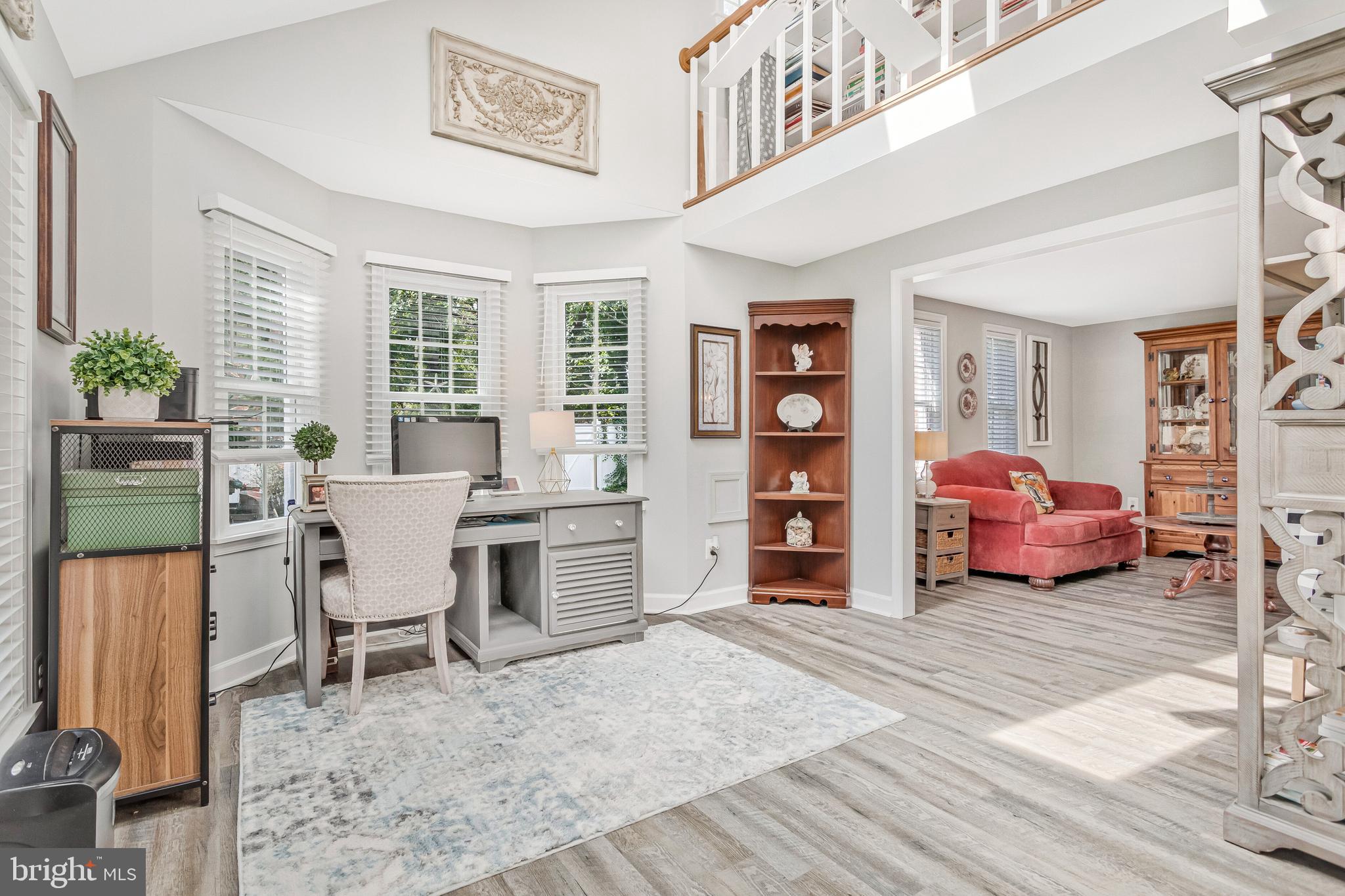 605 Barstow Road Prince Frederick, MD 20678 - Photo 7 of 57 a living room with furniture and a large window