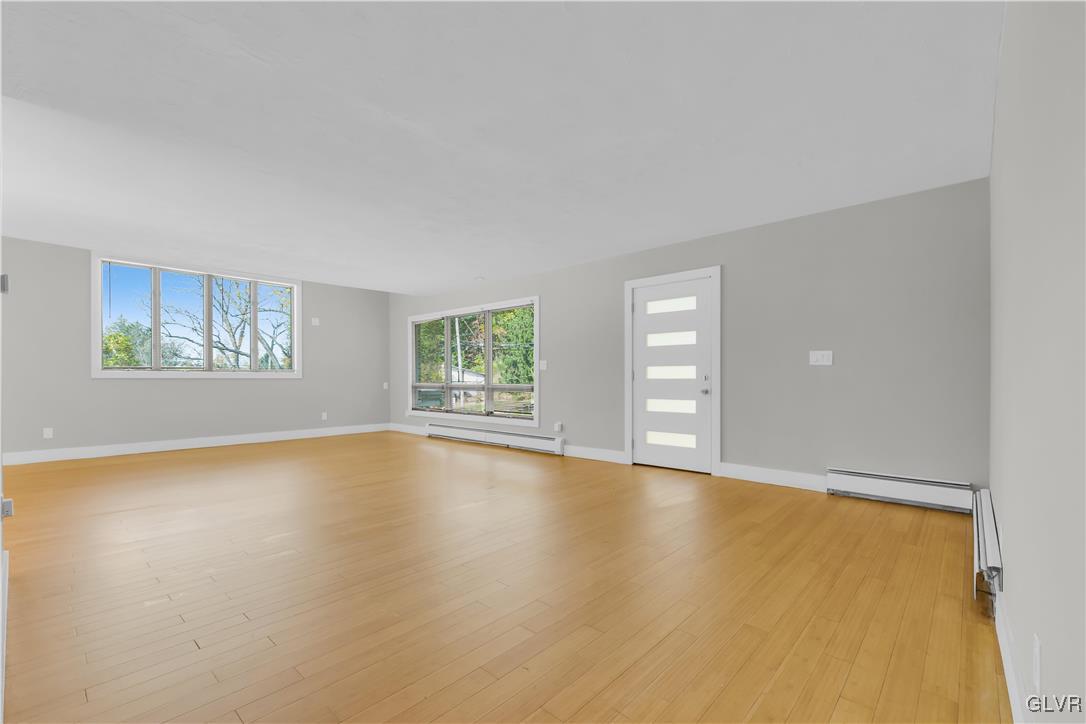 820 Morvale Road Easton, PA 18042 - Photo 17 of 50 a view of an empty room with window and wooden floor
