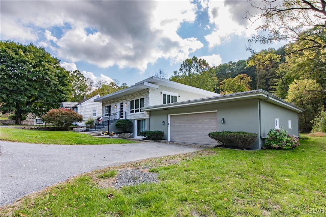 820 Morvale Road Easton, PA 18042 - Photo 2 of 50 a front view of a house with garden