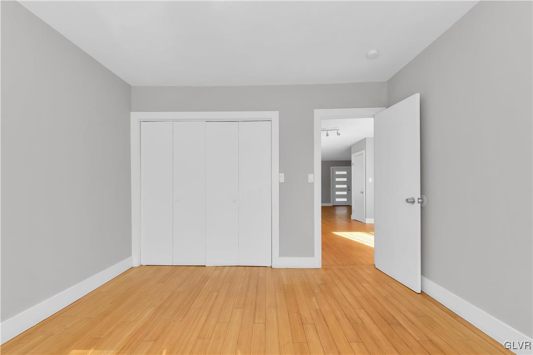 820 Morvale Road Easton, PA 18042 - Photo 26 of 50 a view of an empty room with wooden floor and a window
