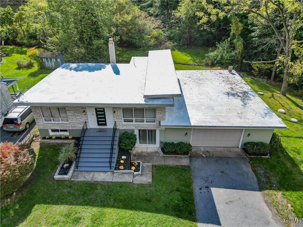 820 Morvale Road Easton, PA 18042 - Photo 3 of 50 an aerial view of a house with a yard patio and fire pit