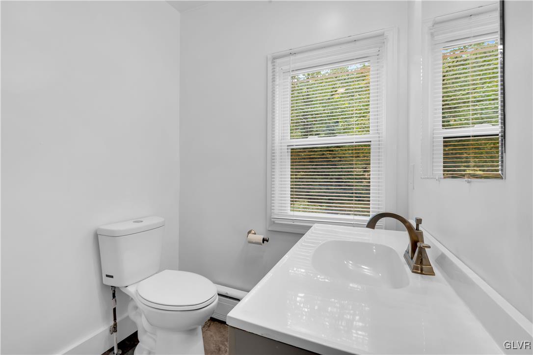 820 Morvale Road Easton, PA 18042 - Photo 33 of 50 a bathroom with a toilet a sink and a window