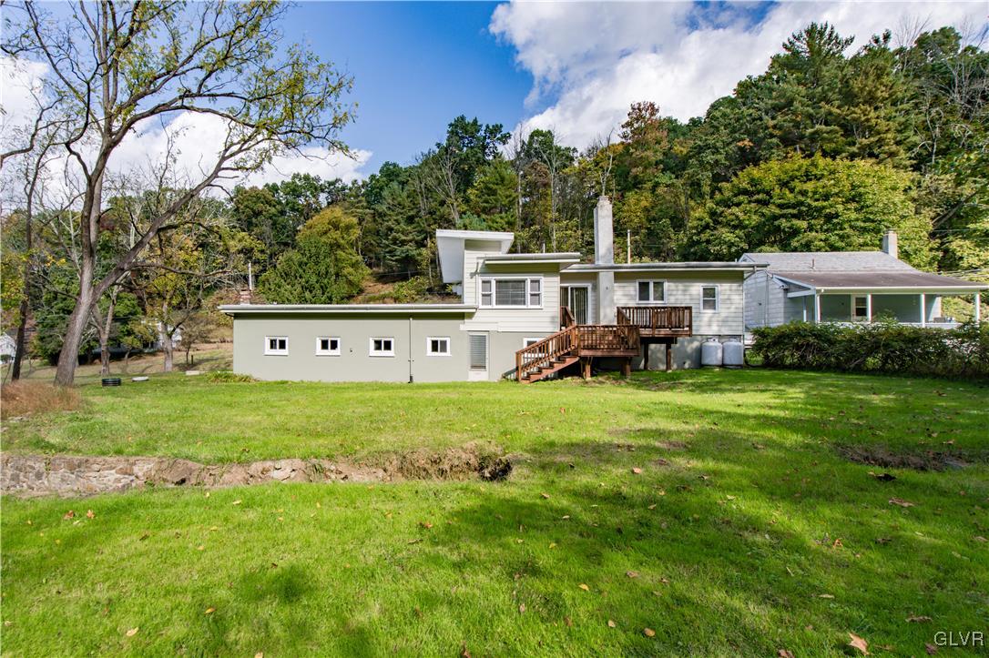 820 Morvale Road Easton, PA 18042 - Photo 10 of 50 a front view of a house with garden and trees