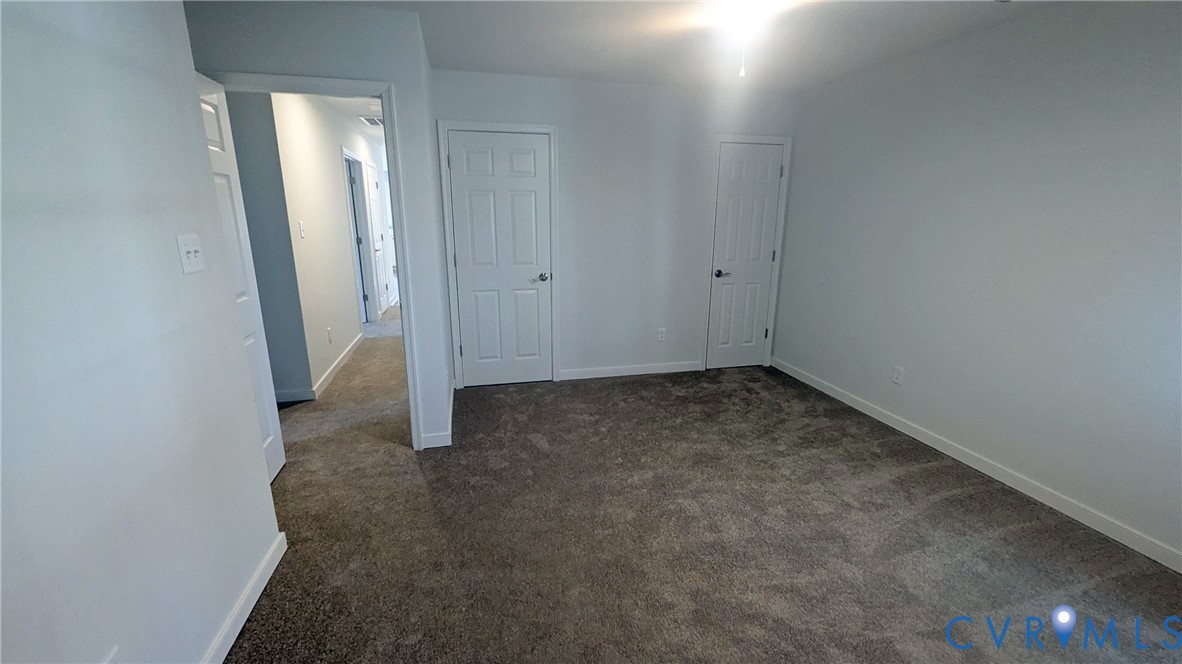 3008 Plumtree Street Colonial Heights, VA 23834 - Photo 9 of 11 Unfurnished bedroom featuring dark colored carpet