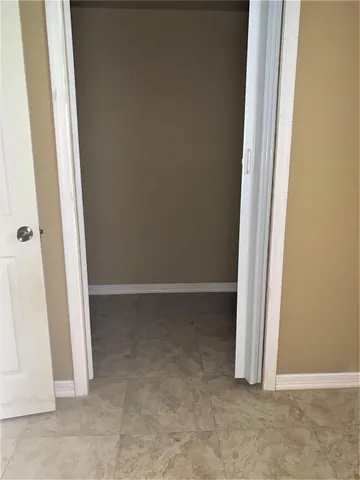 a view of a small house with a yard