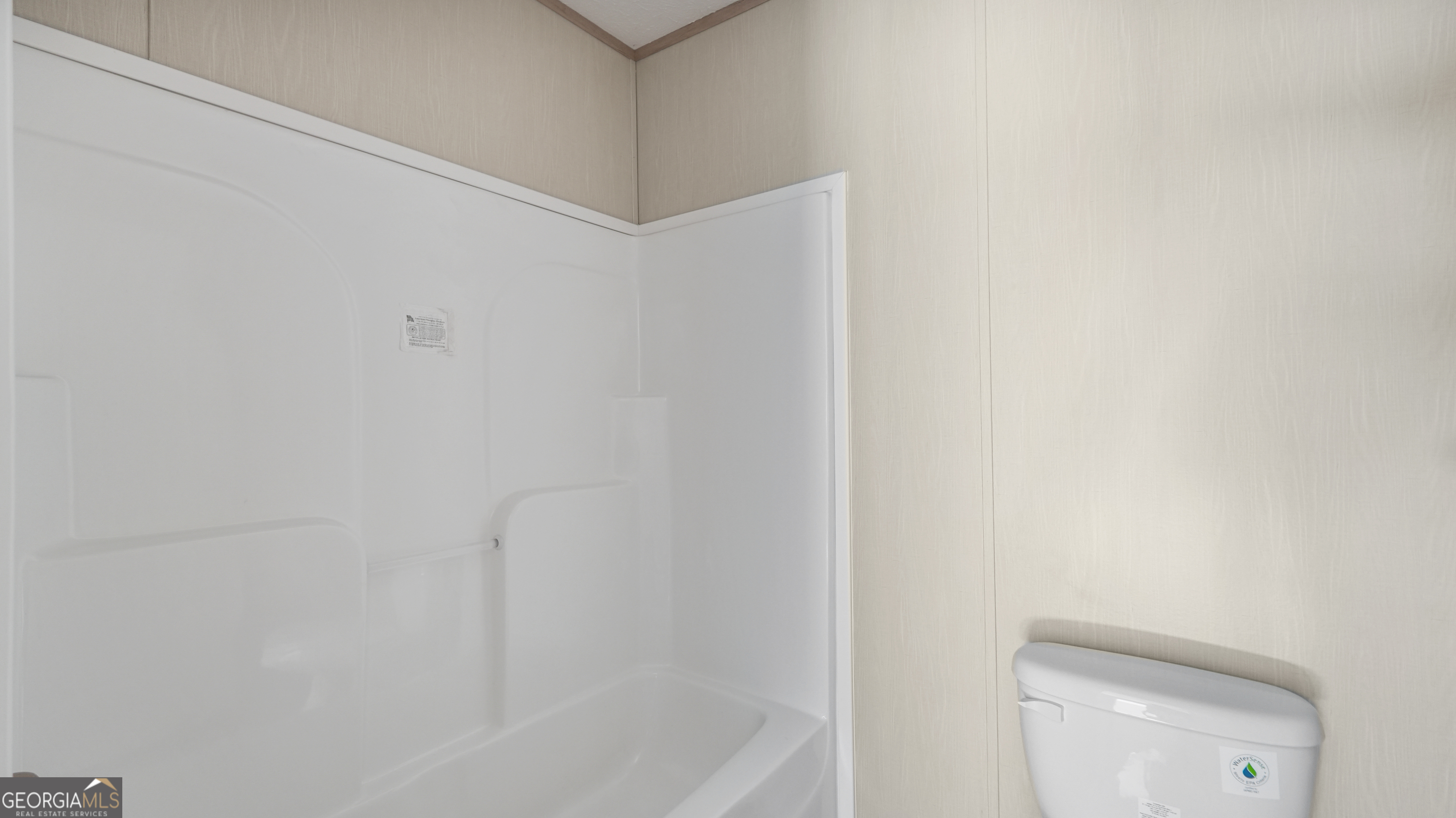 123 Daniel Street Waynesville, GA 31566 - Photo 12 of 36 a bath room with a toilet and a bath tub