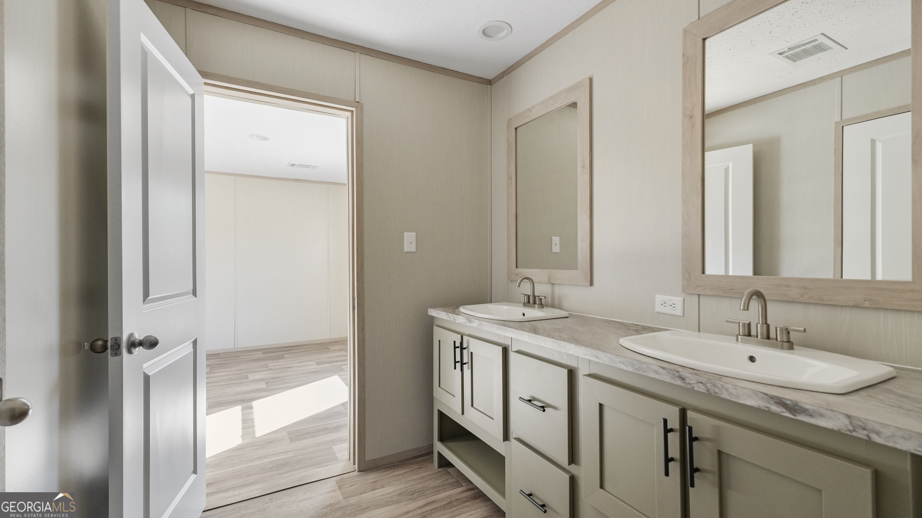 123 Daniel Street Waynesville, GA 31566 - Photo 13 of 36 a bathroom with a granite countertop sink and a mirror