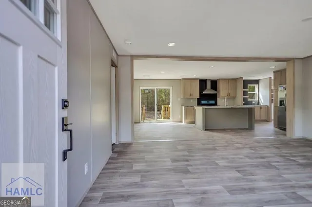 a view of a kitchen with a sink and a window