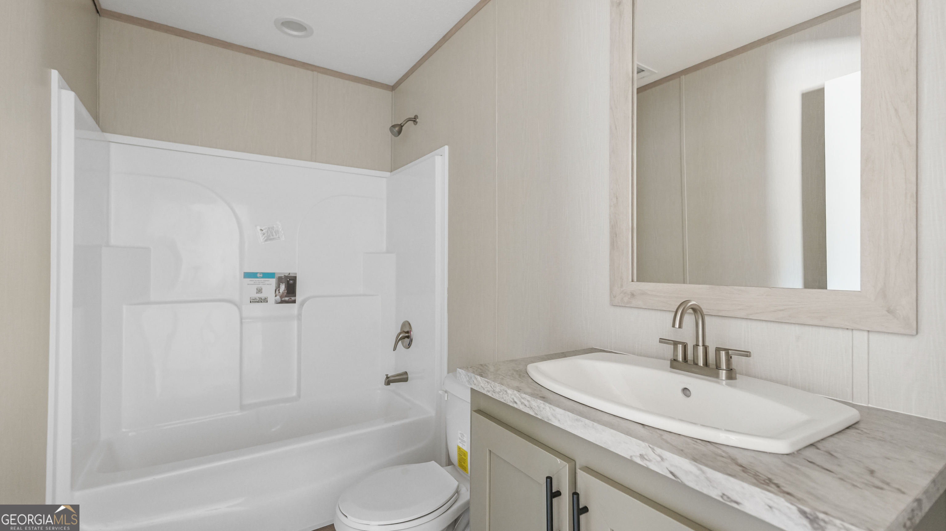 123 Daniel Street Waynesville, GA 31566 - Photo 17 of 36 a bathroom with a sink toilet and shower