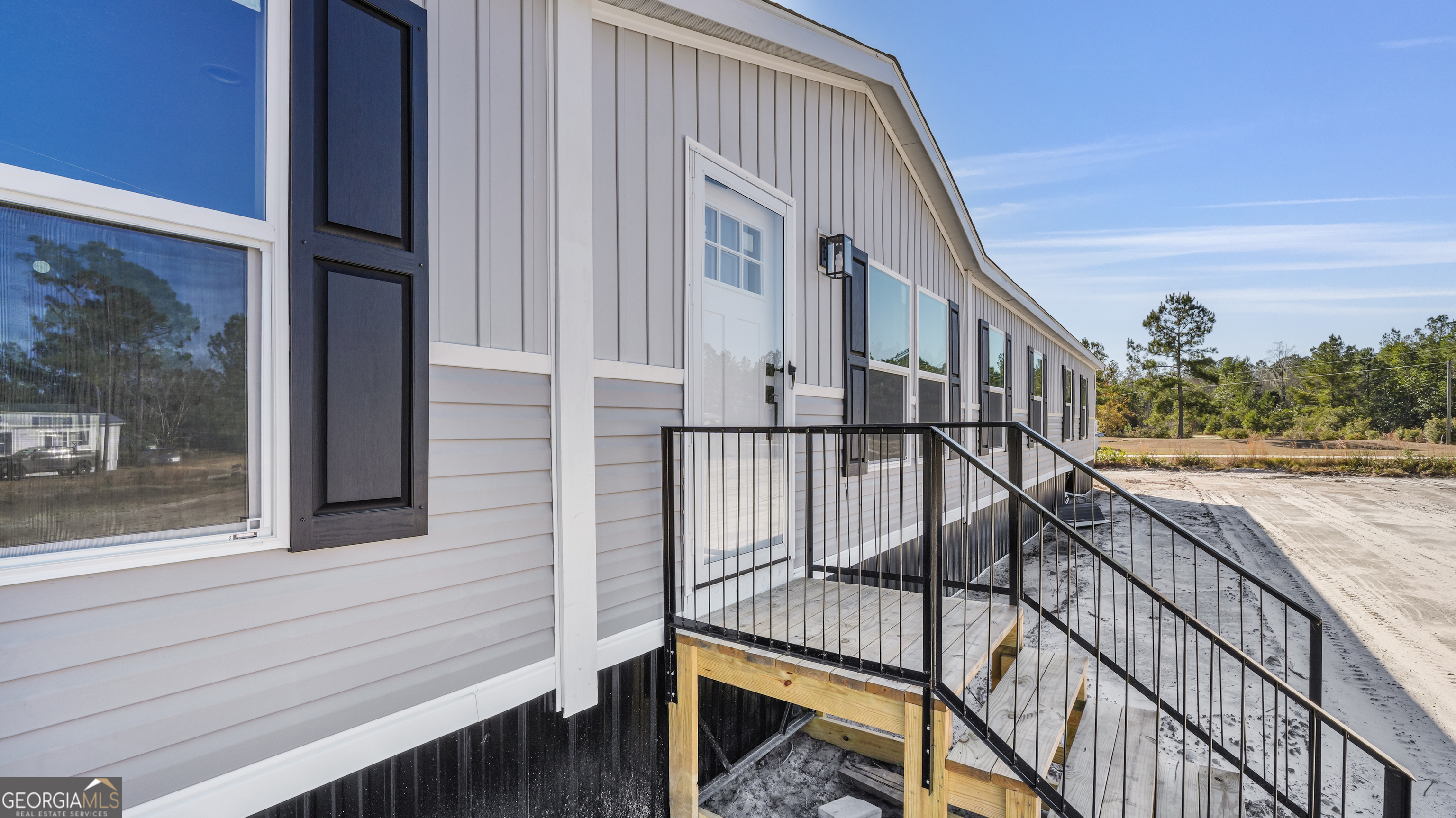 123 Daniel Street Waynesville, GA 31566 - Photo 28 of 36 a view of balcony with wooden floor and fence