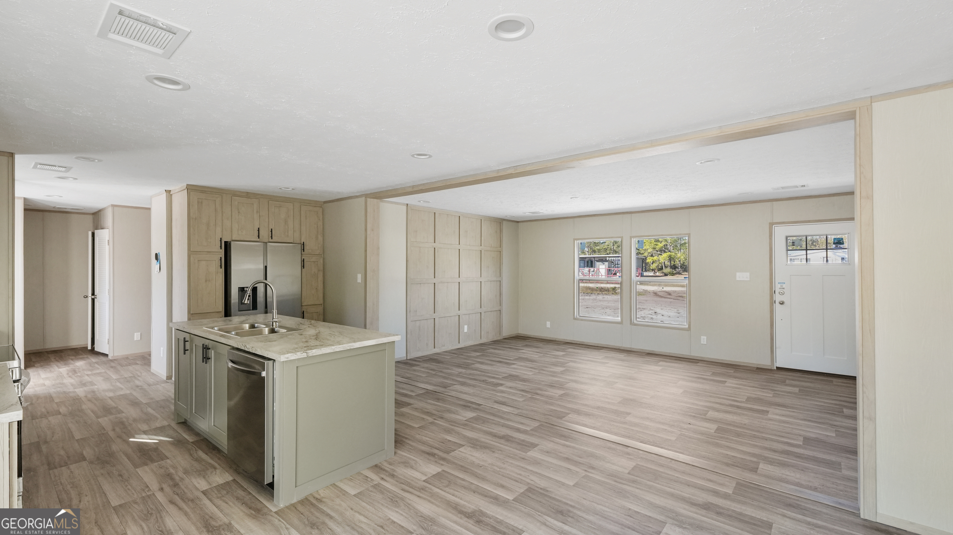123 Daniel Street Waynesville, GA 31566 - Photo 3 of 36 a view of kitchen island with wooden floor