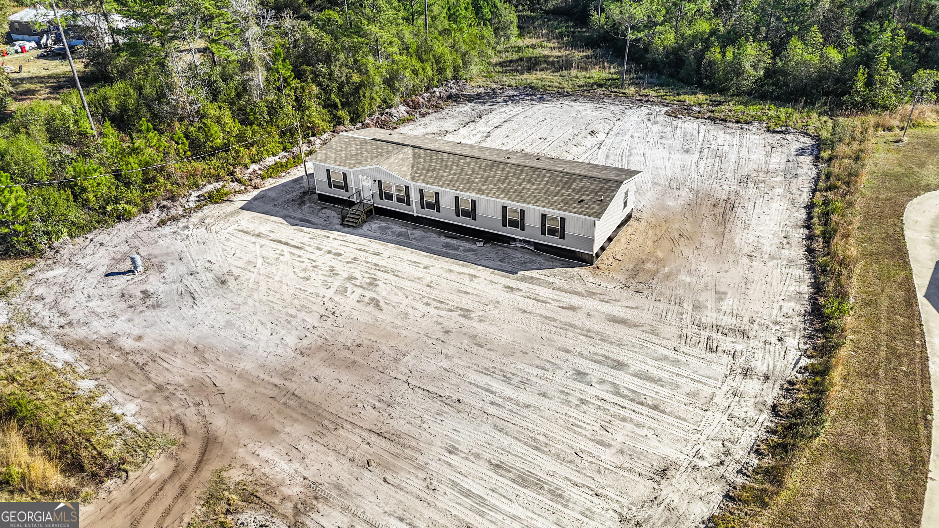 123 Daniel Street Waynesville, GA 31566 - Photo 33 of 36 a view of a backyard with a yard