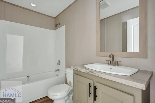 a bathroom with a sink toilet and a bathtub