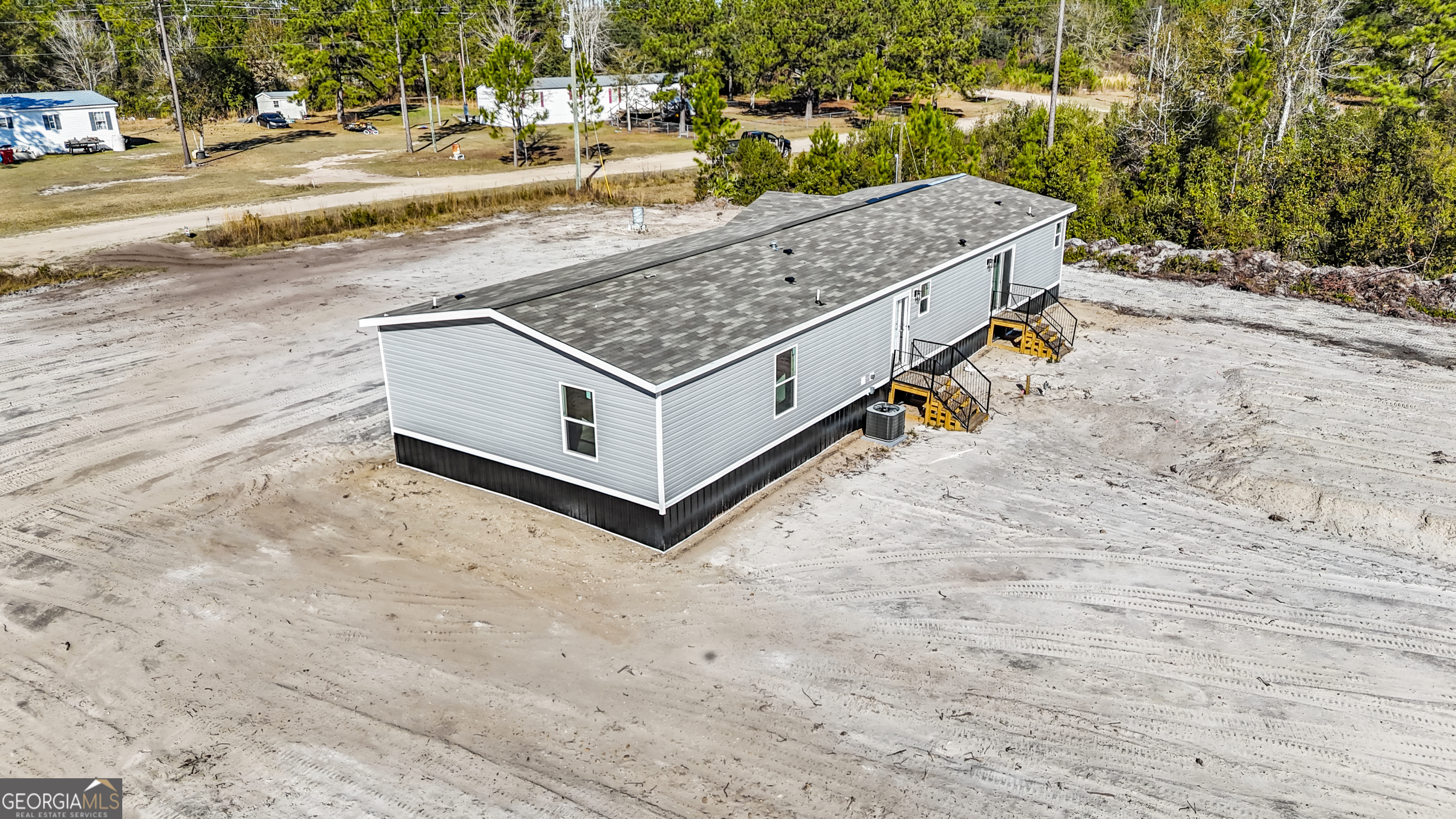 123 Daniel Street Waynesville, GA 31566 - Photo 35 of 36 a view of a terrace with a bench