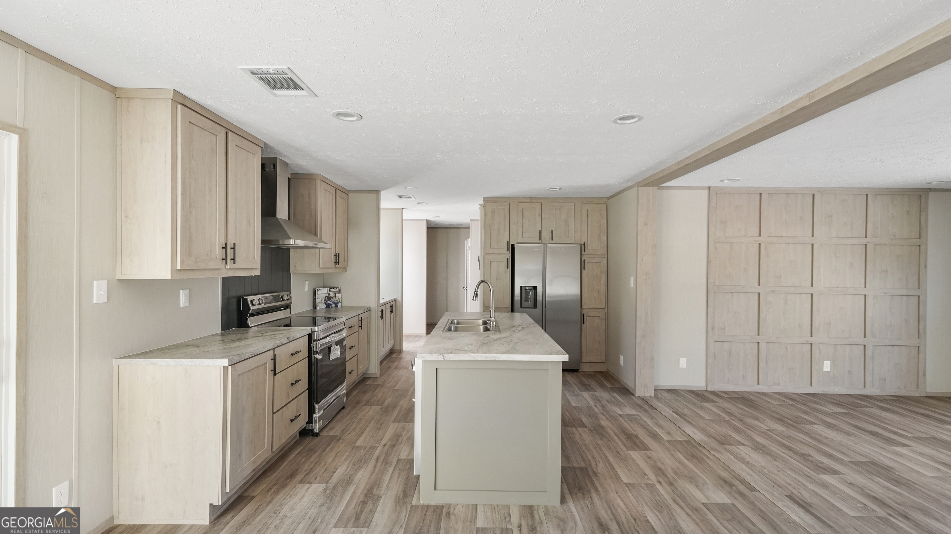 123 Daniel Street Waynesville, GA 31566 - Photo 4 of 36 a kitchen with a sink stove and refrigerator