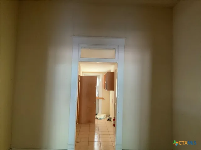 a view of a bathroom from a hallway