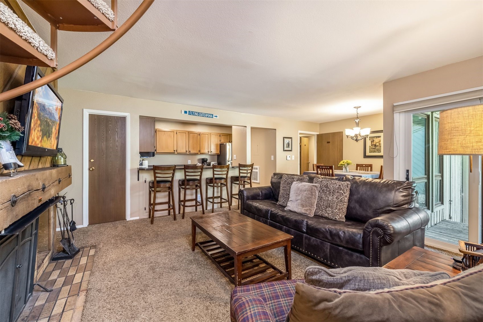 1977 Soda Ridge Road, Unit 1194 Keystone, CO 80435 - Photo 26 of 38 a living room with furniture and a flat screen tv
