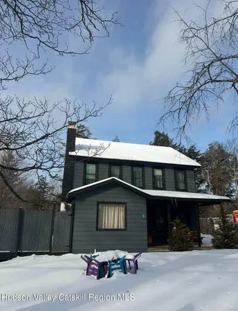 a front view of a house with yard