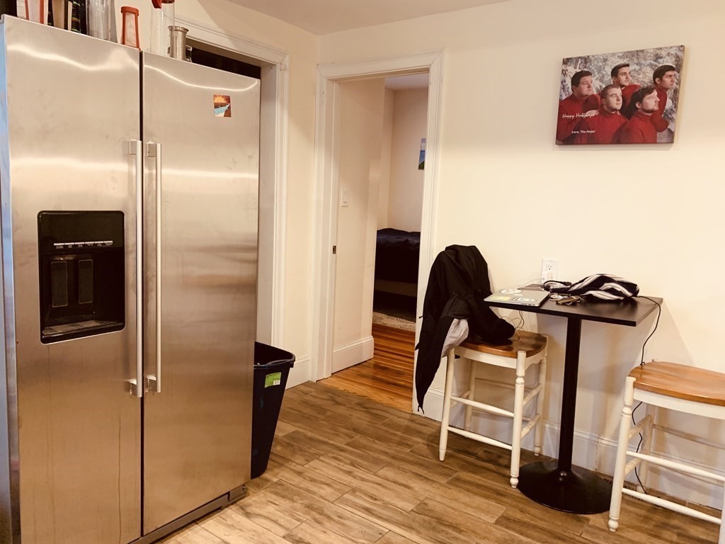 31 Edison Green, Unit 2 Boston, MA 02125 - Photo 5 of 16 a view of a hallway with wooden floor and closet