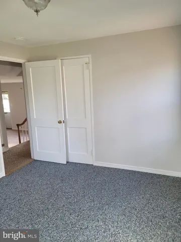 an empty room with a bench