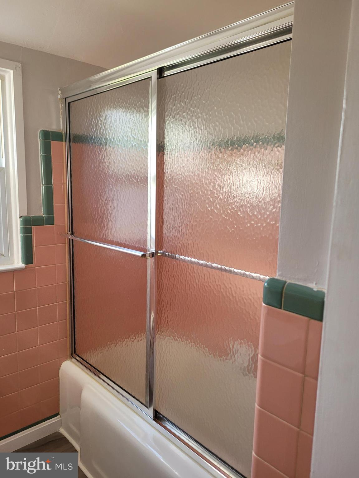 1217 Sheridan Street Reading, PA 19611 - Photo 17 of 38 a bathroom with a glass shower door