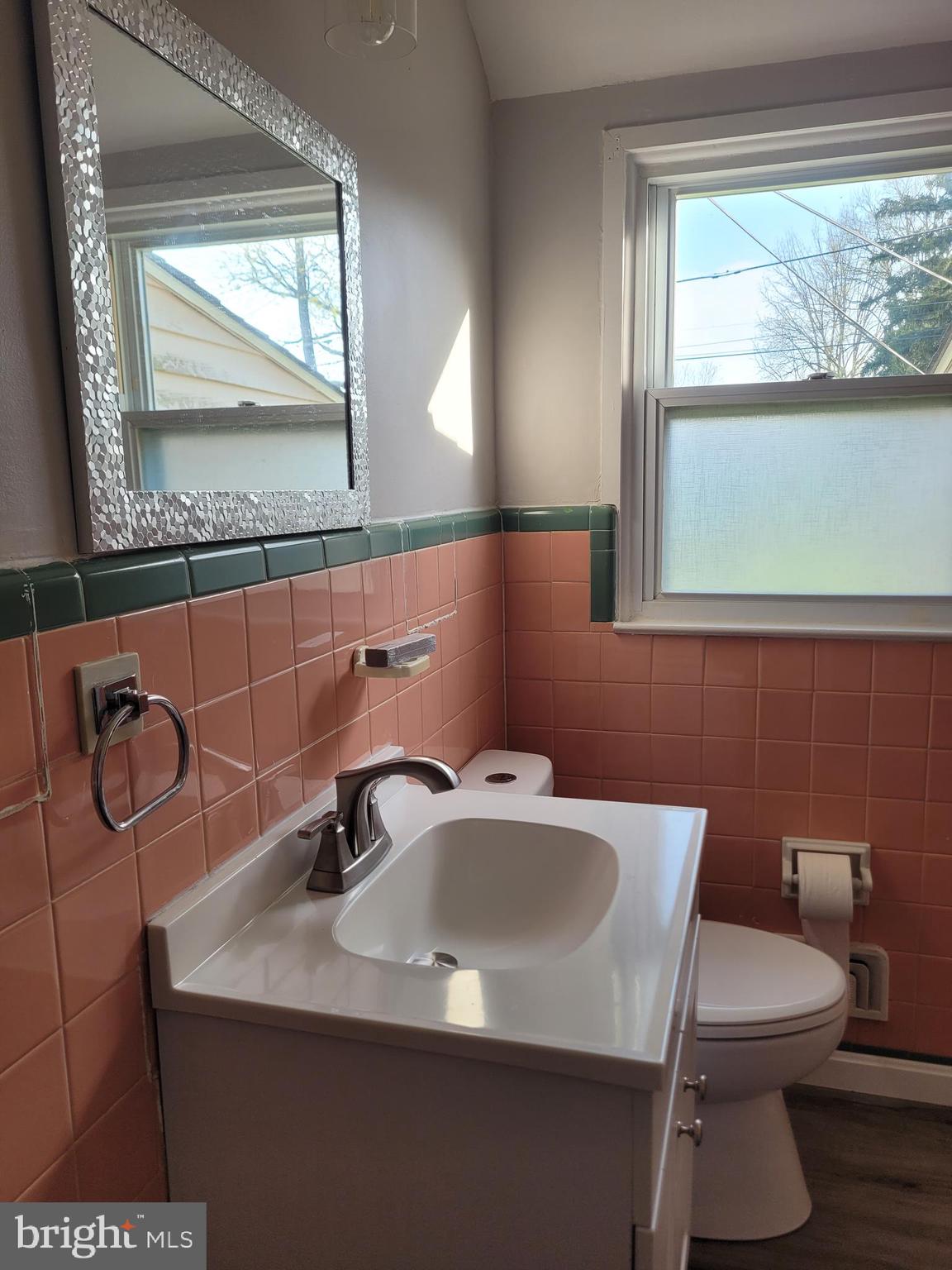 1217 Sheridan Street Reading, PA 19611 - Photo 18 of 38 a bathroom with a sink a toilet and a mirror