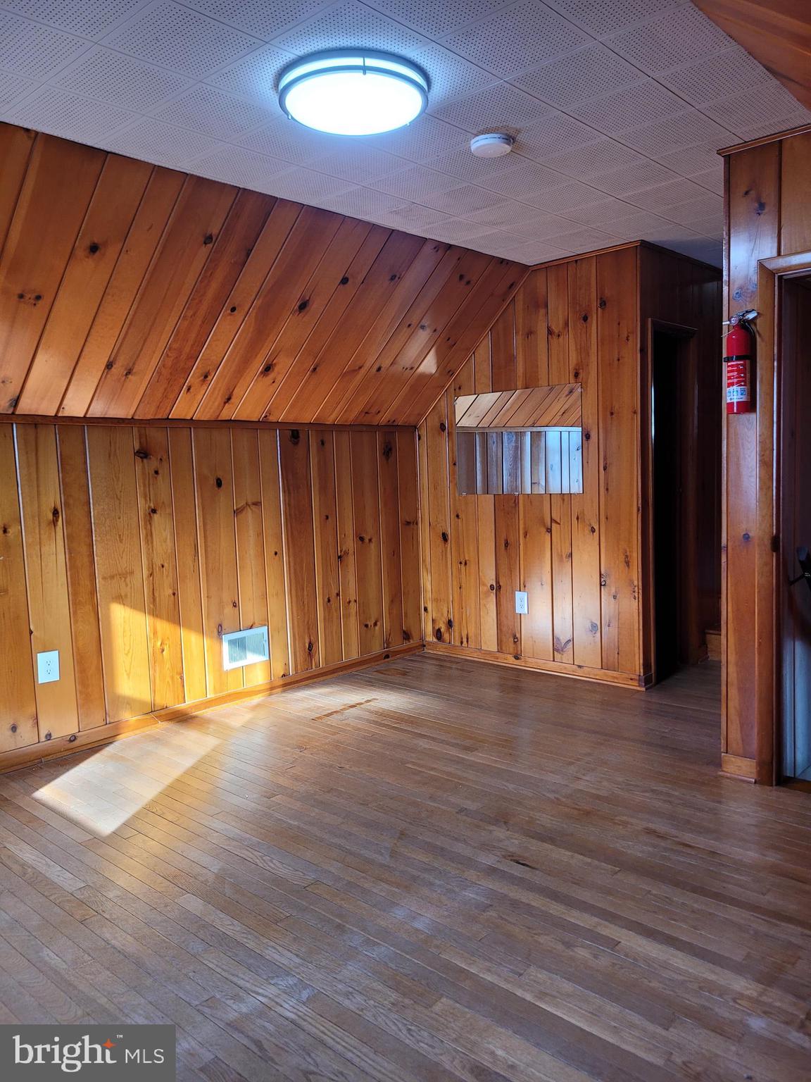 1217 Sheridan Street Reading, PA 19611 - Photo 21 of 38 a view of an empty room with wooden floor
