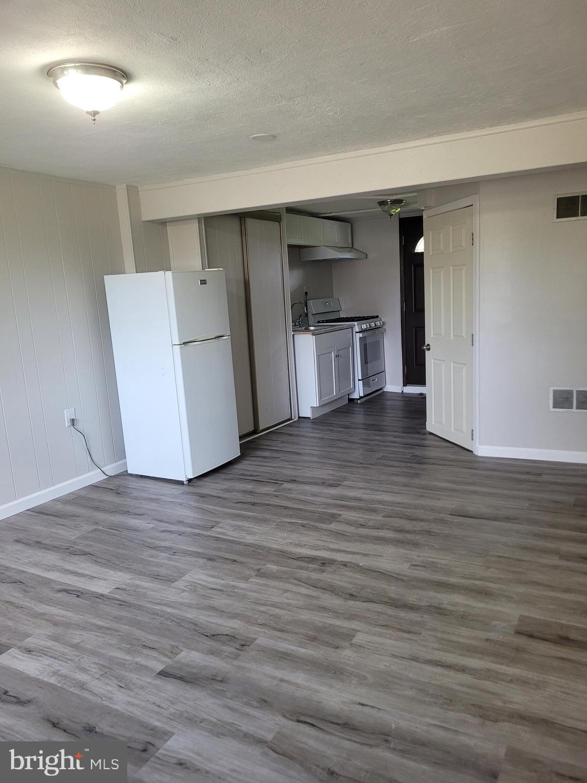 1217 Sheridan Street Reading, PA 19611 - Photo 31 of 38 a view of empty room with wooden floor