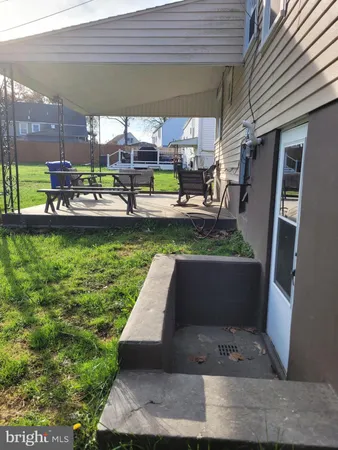 a view of swimming pool with outdoor seating