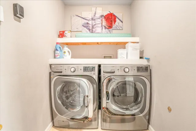 a spacious bedroom with a bed and glass window