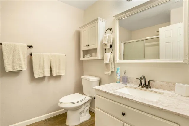 a bathroom with a glass shower door