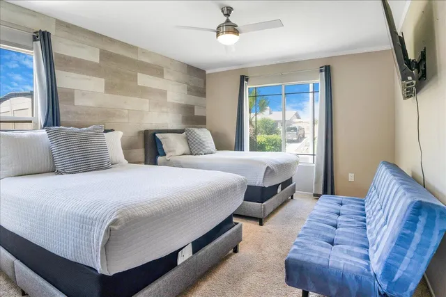 a bedroom with double bed and a large mirror