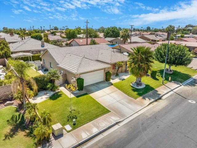 an aerial view of a house with a garden