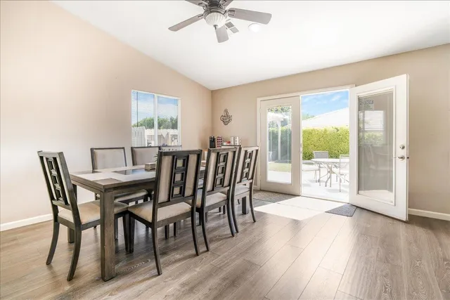 a view of a dining room with furniture window and wooden floor
