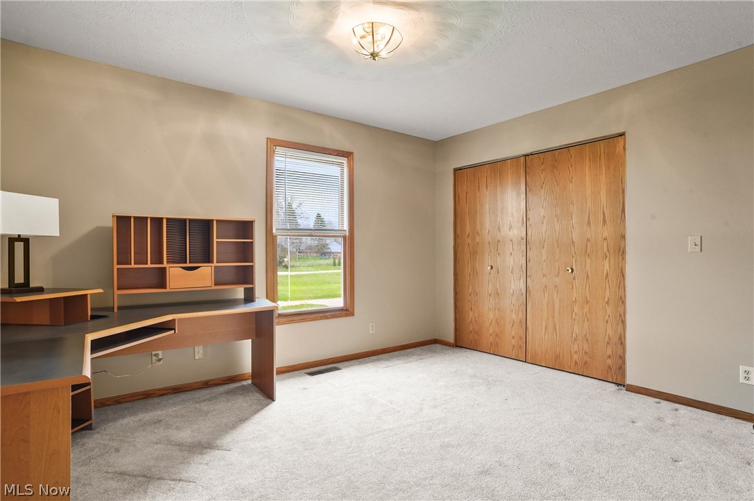1106 Apple Ridge Road Clinton, OH 44216 - Photo 22 of 27 Carpeted office with a textured ceiling