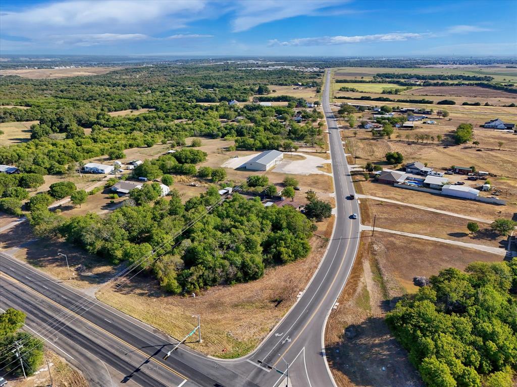 12906 Chapel Road Lorena, TX 76655 - Photo 7 of 16 Expansive undeveloped land featuring mature trees and clearings with direct road frontage