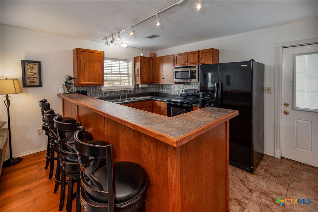 19 Dewberry Lane Seadrift, TX 77983 - Photo 18 of 40 Well-equipped kitchen with plenty of storage and counter space.