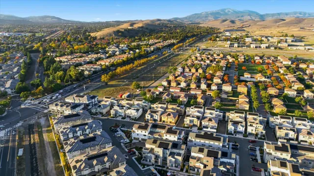 a view of a brick house with many windows