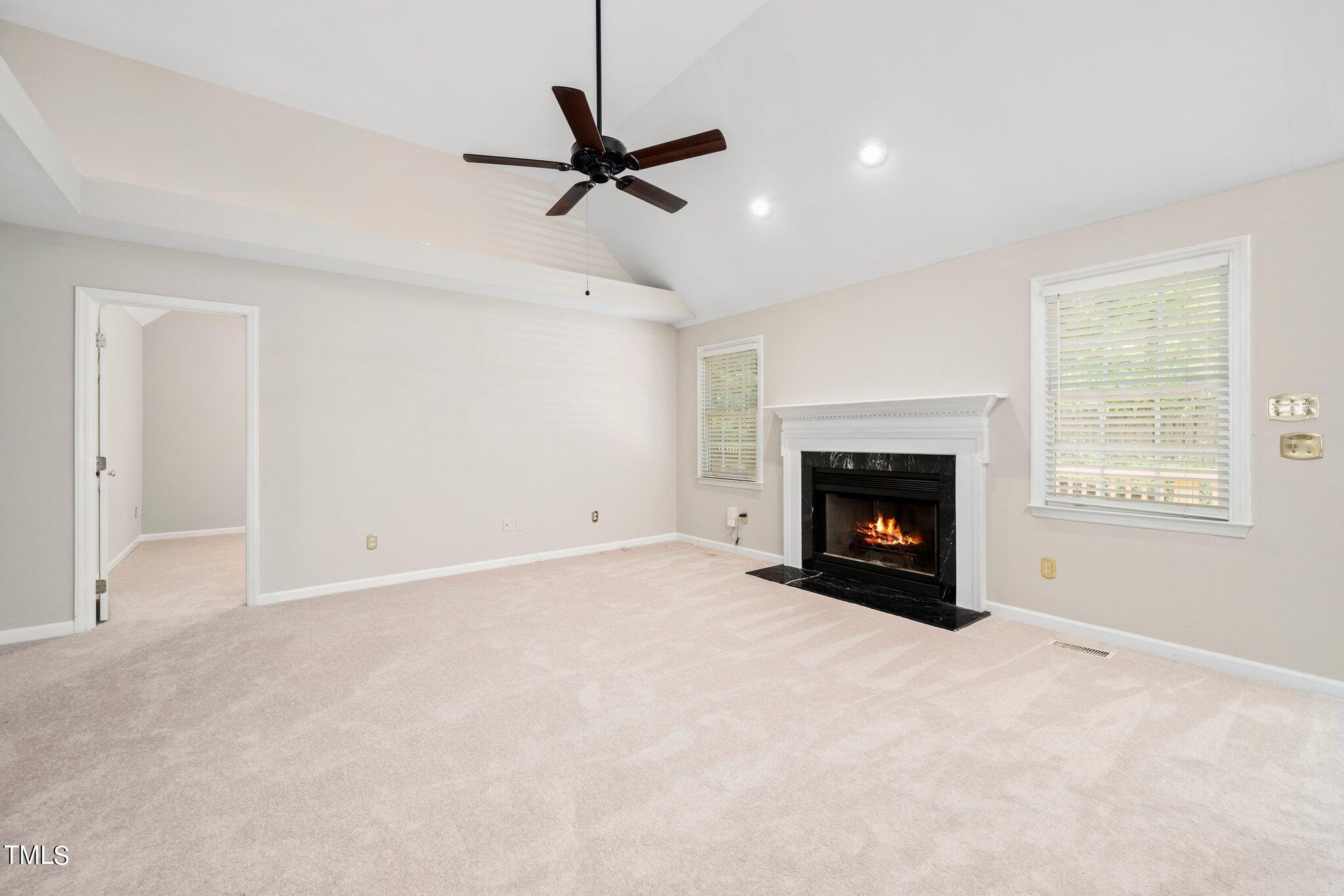 12216 Freemont Lane Raleigh, NC 27613 - Photo 13 of 23 a view of empty room with a fireplace