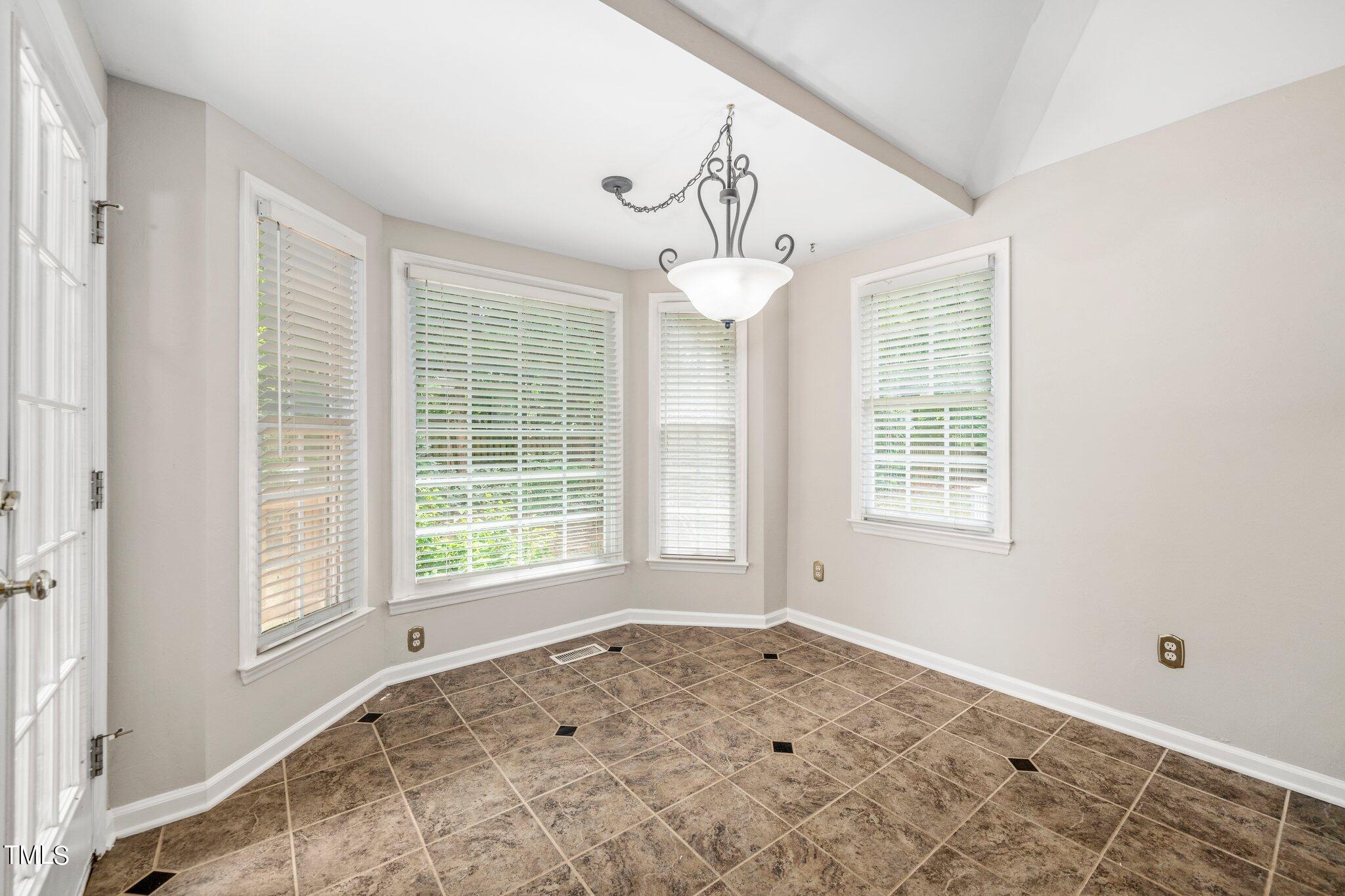12216 Freemont Lane Raleigh, NC 27613 - Photo 14 of 23 a view of an empty room with a window