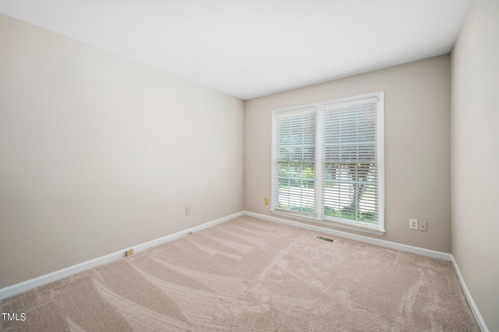 12216 Freemont Lane Raleigh, NC 27613 - Photo 18 of 23 an empty room with a window