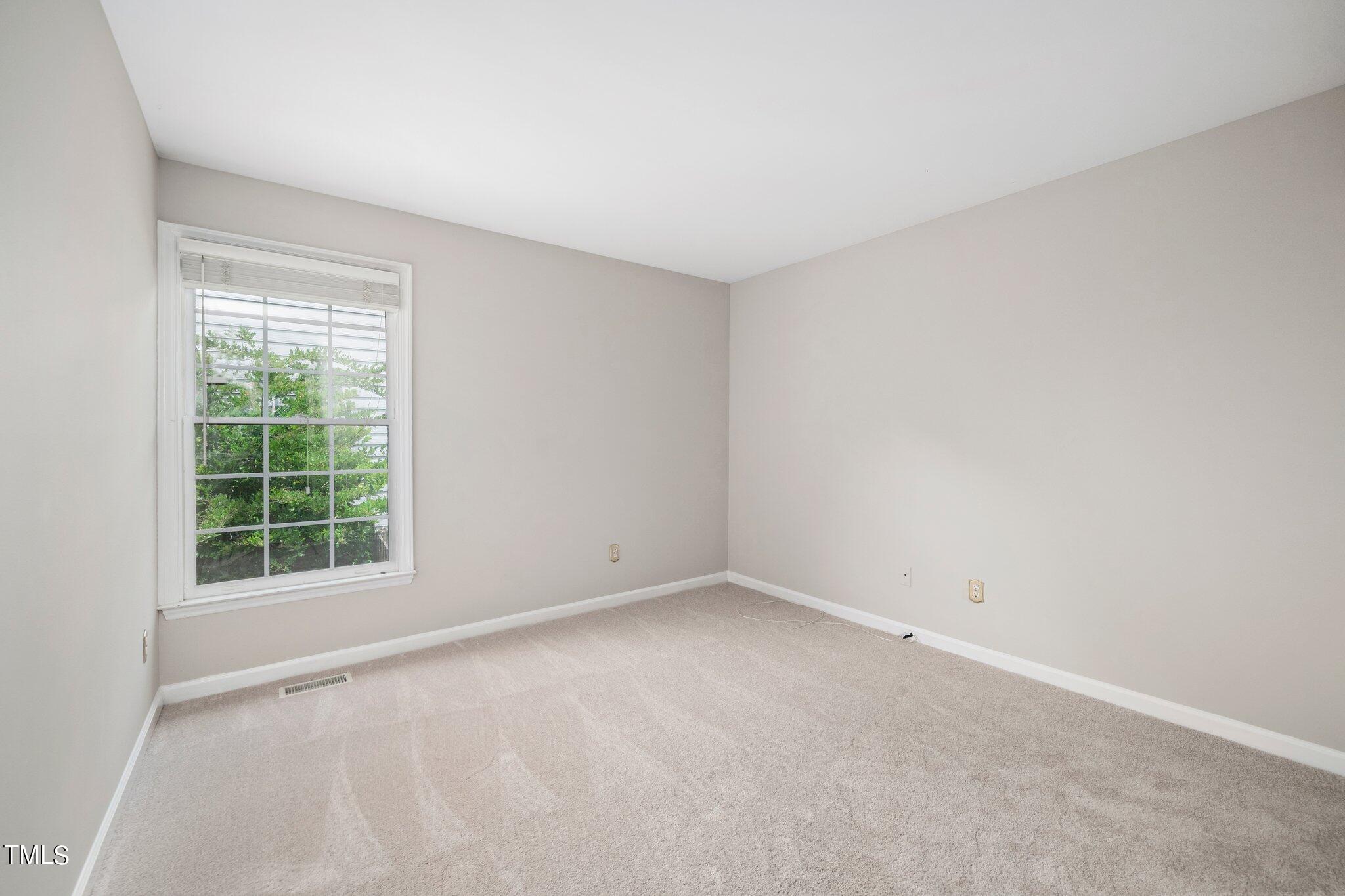 12216 Freemont Lane Raleigh, NC 27613 - Photo 19 of 23 an empty room with a window