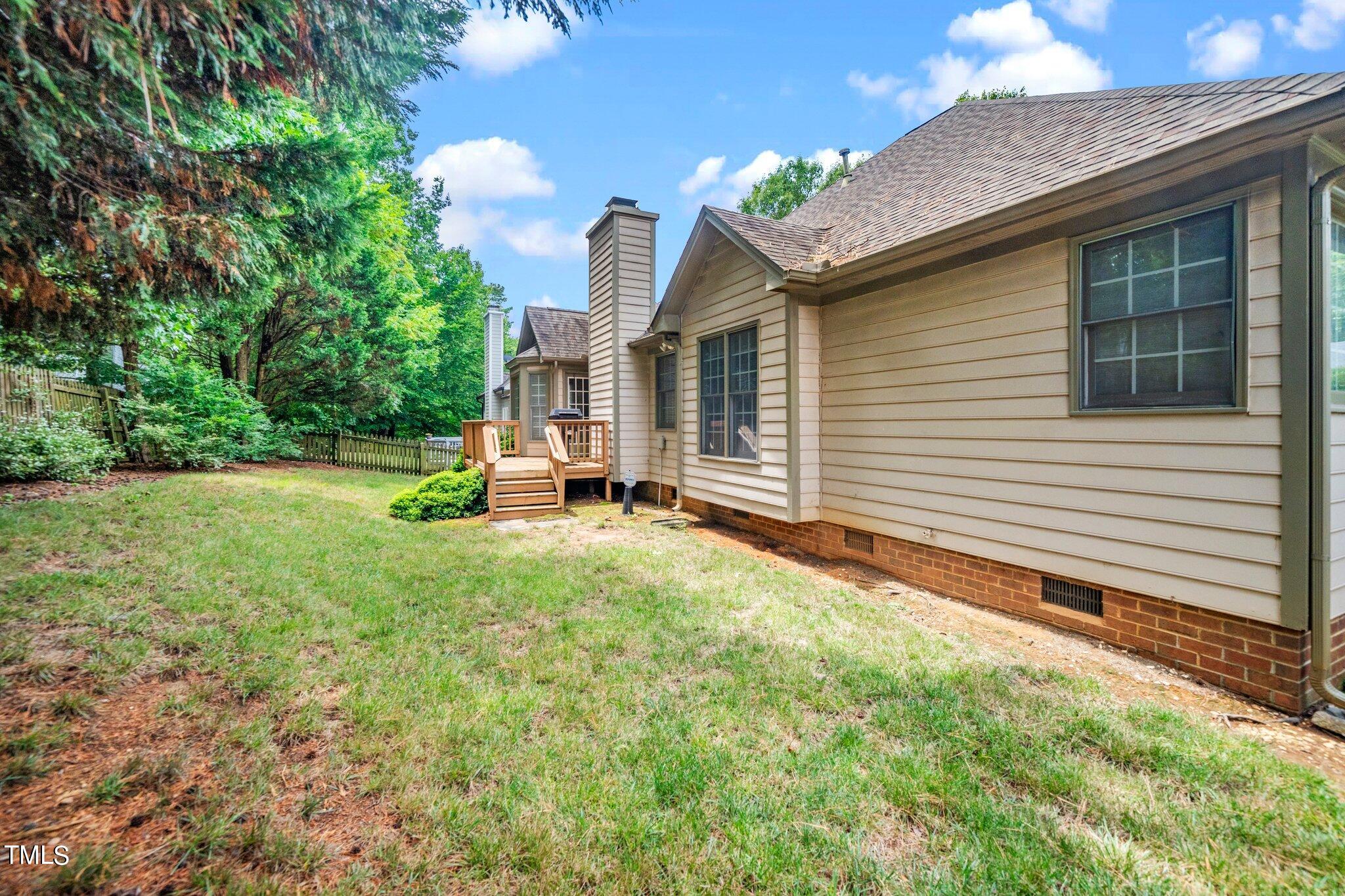 12216 Freemont Lane Raleigh, NC 27613 - Photo 22 of 23 a front view of a house with a yard