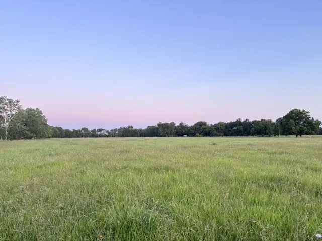 a view of a lake and sunset