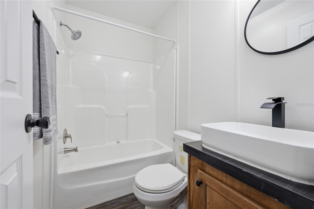 215 Southwest Alpine Place High Springs, FL 32643 - Photo 21 of 41 a bathroom with a sink a toilet and a mirror